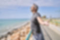 Middle age hispanic man wearing sportswear breathing at seaside.jpg