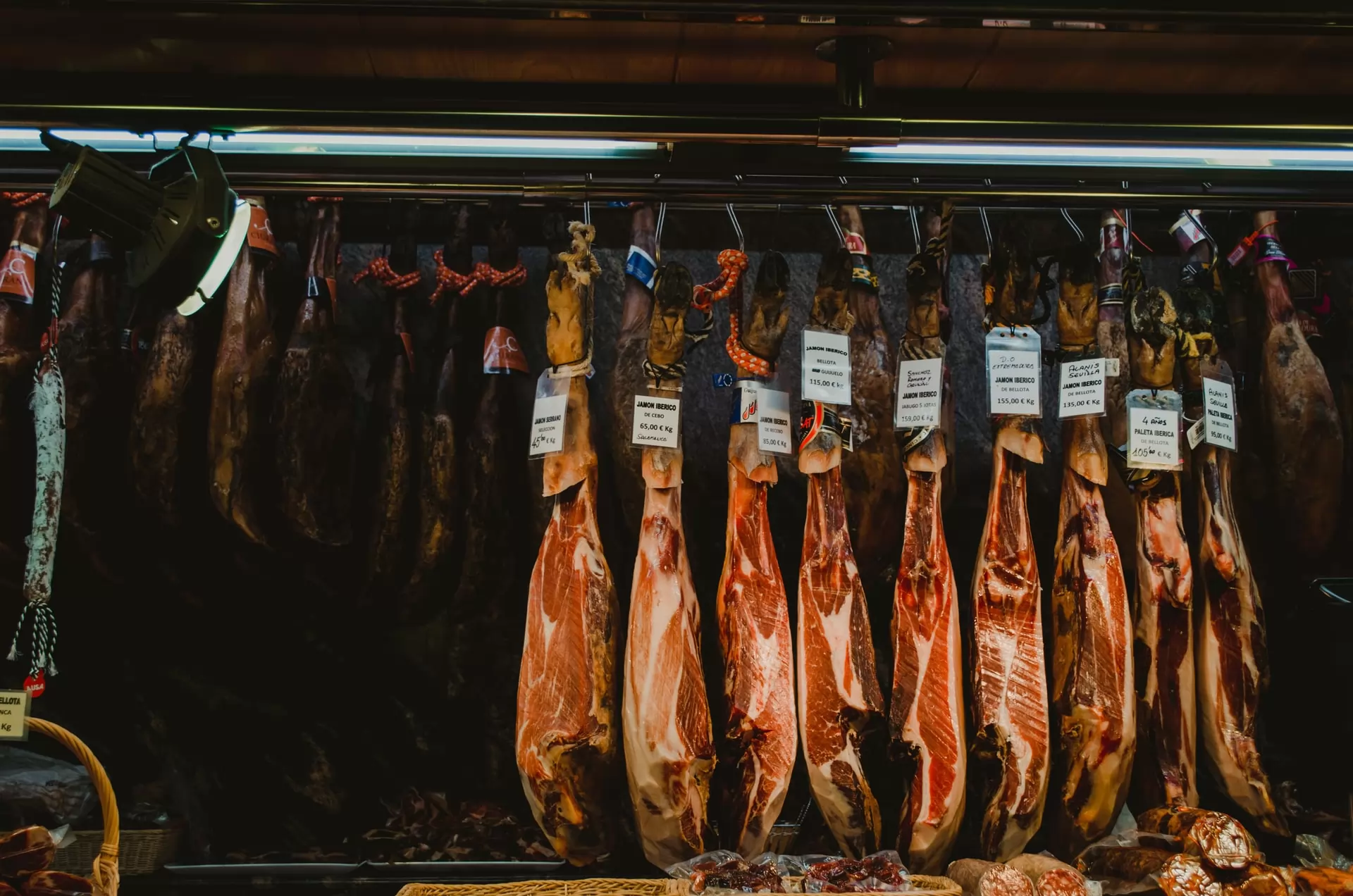 Cured meat hanging in the market of Emilia-Romagna