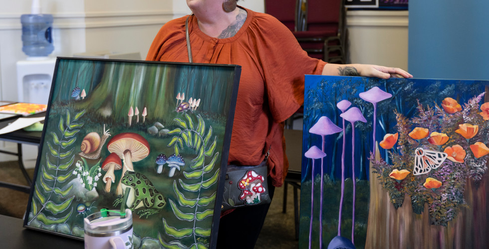 Artist drops off her paintings for the Public Works exhibit