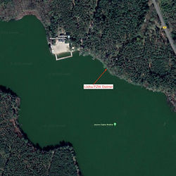 Aerial view of the lake with visible text: Jezioro PZW Stelmet Zawody Odra Siedlisko.