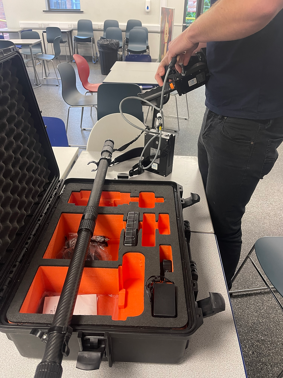 Assembling the GeoSLAM LiDAR scanner on site.