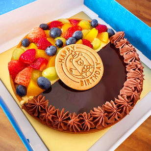Duo flavour whole tart with mixed fruit and dark chocolate with birthday topper