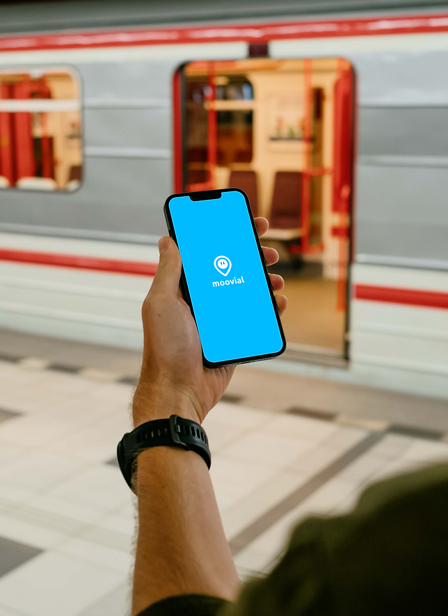 User holding an iPhone 13 mockup (Mockuuups Studio).png