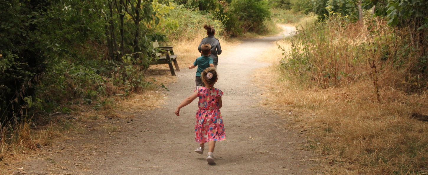 Children enjoying the wide woodland paths at Coed y Morfa, Prestatyn.