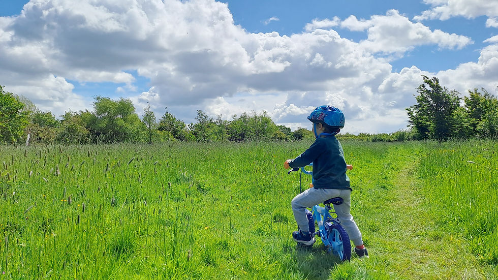 Child on bike at Rhuddlan Nature Reserve