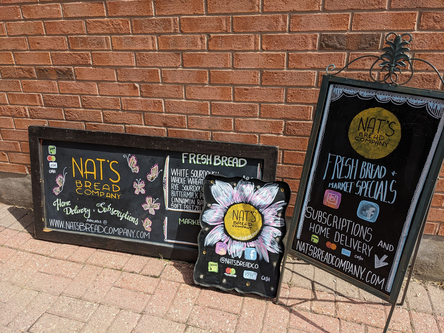 A collection of three different decorative menu chalkboard for Nat's Bread Co.