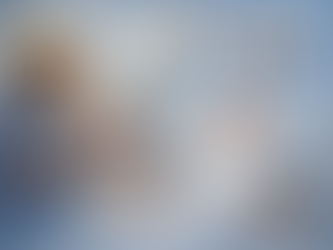 Bedside nurse reviewing an AI clinical alert while assessing a stable hospitalized patient