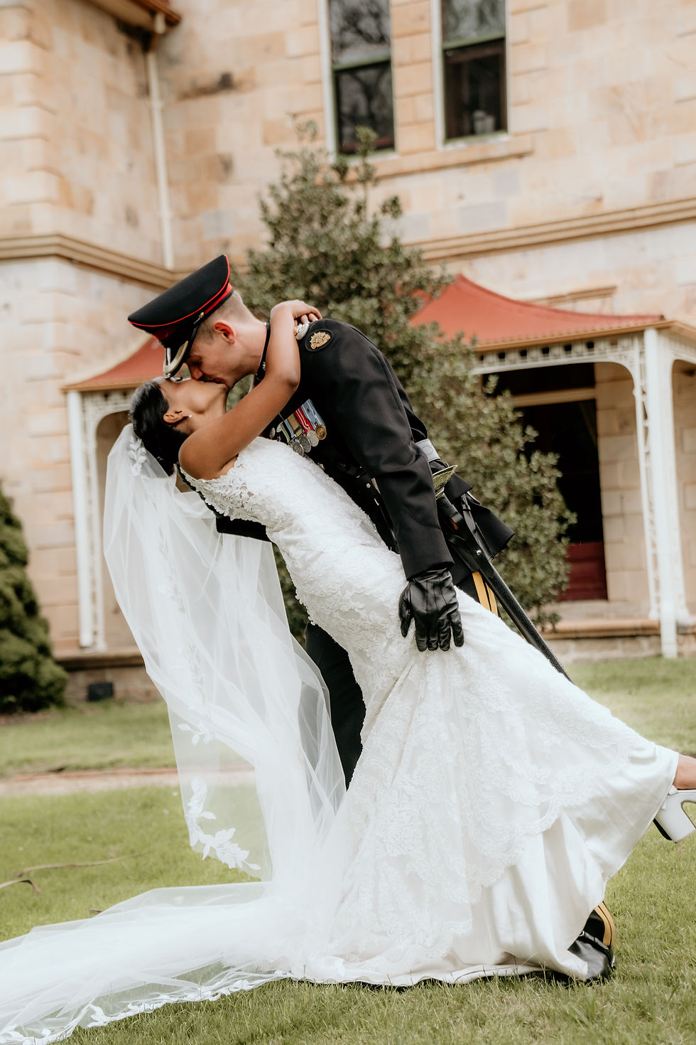 Bride and Groom Dip Kiss Lawns of Royal Military College Duntroon House