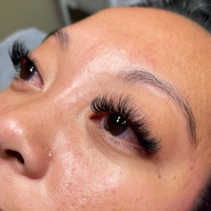 Close-up of eye with beautiful black eyelashes. Perfect makeup look.