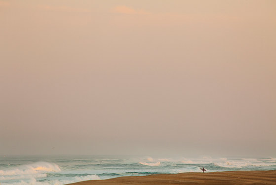 semi abstract fine-art surf photograph by Cristian Corradin
Sunrise in Hossegor, surfer silhouette on the beach, wave set