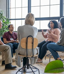 A group of people discussing mental health