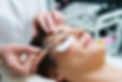 woman having eye lashes tinted in beauty salon.jpg