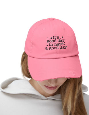 Cute woman with stickers wearing a black bucket hat embroidered with a tribal sea turtle design