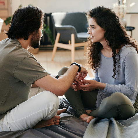 Two adults sharing a supportive conversation that promotes emotional healing and mental wellness