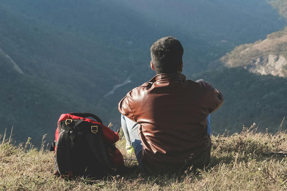 Person calmly setting a boundary by choosing peace in a natural outdoor environment, representing energy protection, self-care, and mental wellness