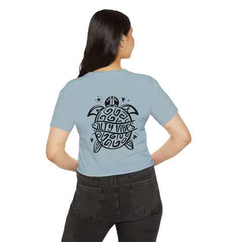 Beautiful  woman in a cool orchid colored vintage beach vibe back print tee