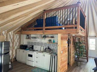 fully equipped kitchen inside a yurt 