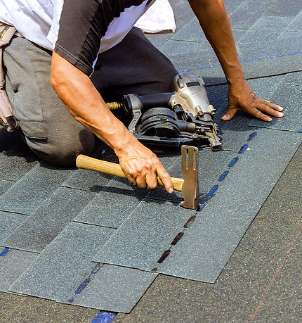 roofer-repairing-roof-with-hammer-and-nail-gun-2026-03-25-00-50-25-utc.jpg