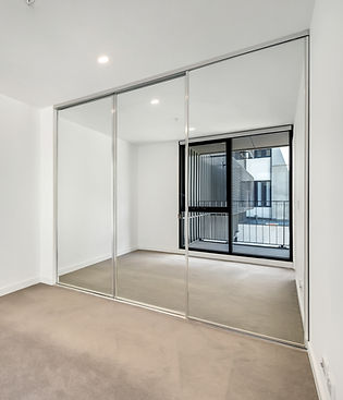 Modern internal glass sliding doors and partitions installed by Spectra Glass and Window Tweed Heads NSW