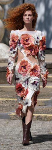 A white dress with 3-D flower applications from the Rodarte Spring 2022 runway presentation at NYFW