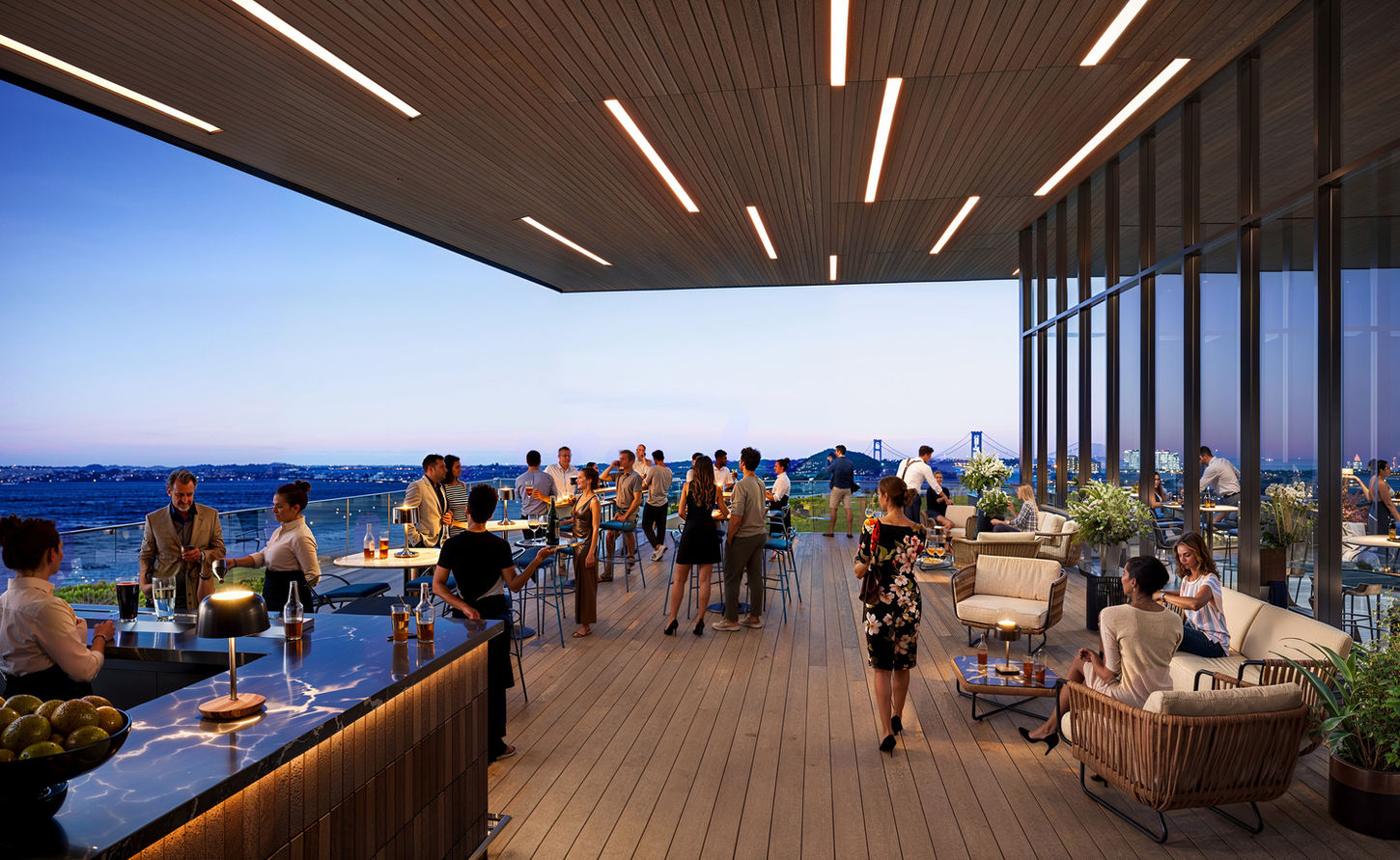 RWU University, New York – rooftop lounge with guests and a panoramic city skyline view at dusk