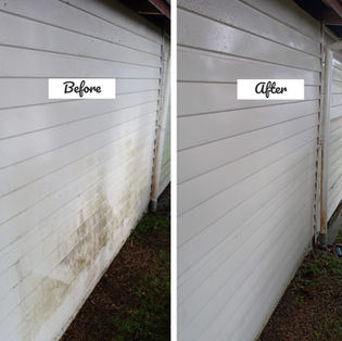 Comparison of dirty and clean house siding after a house wash.