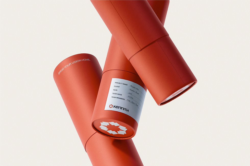 Kennith Infraventures branded architectural drawing tubes in orange with geometric logo, project information, and tagline ‘Bring Your Vision Home.