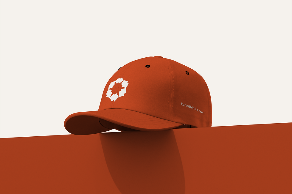 Kennith Infraventures orange baseball cap with white geometric brand logo, modern promotional merchandise for architecture company.