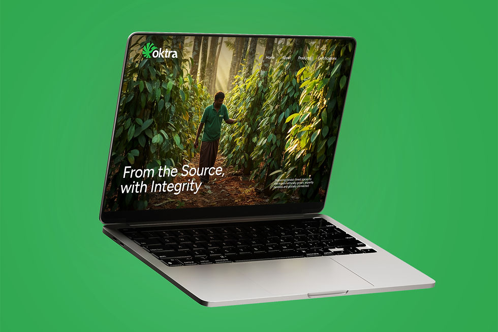 Oktra Enterprises website homepage on a laptop screen, showing a plantation scene and the tagline ‘From the Source, with Integrity’ for Kerala spice exporting business.