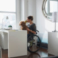 Woman in Wheelchair Drinking Coffee
