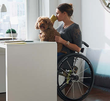 Woman in Wheelchair Drinking Coffee