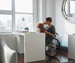 Woman in Wheelchair Drinking Coffee