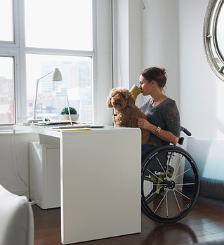 Woman in Wheelchair Drinking Coffee