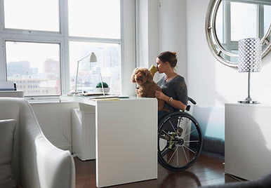 Woman in Wheelchair Drinking Coffee