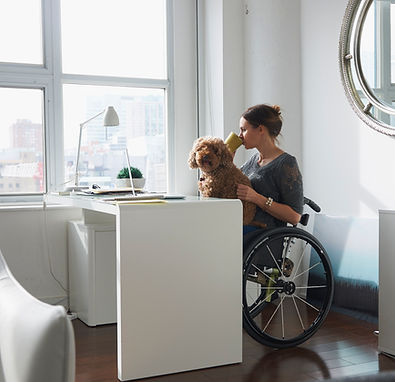 Woman in Wheelchair Drinking Coffee