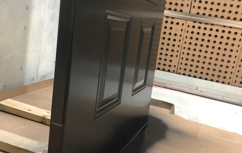 black exterior door in spray booth