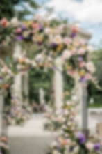 garden wedding ceremony arches at the Elms Mansion, New Orleans florist, courtyard wedding