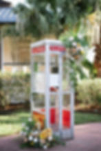 a vintage phone booth covered in flowers for a guest book moment by Leaf + Petal at Audubon Clubhouse