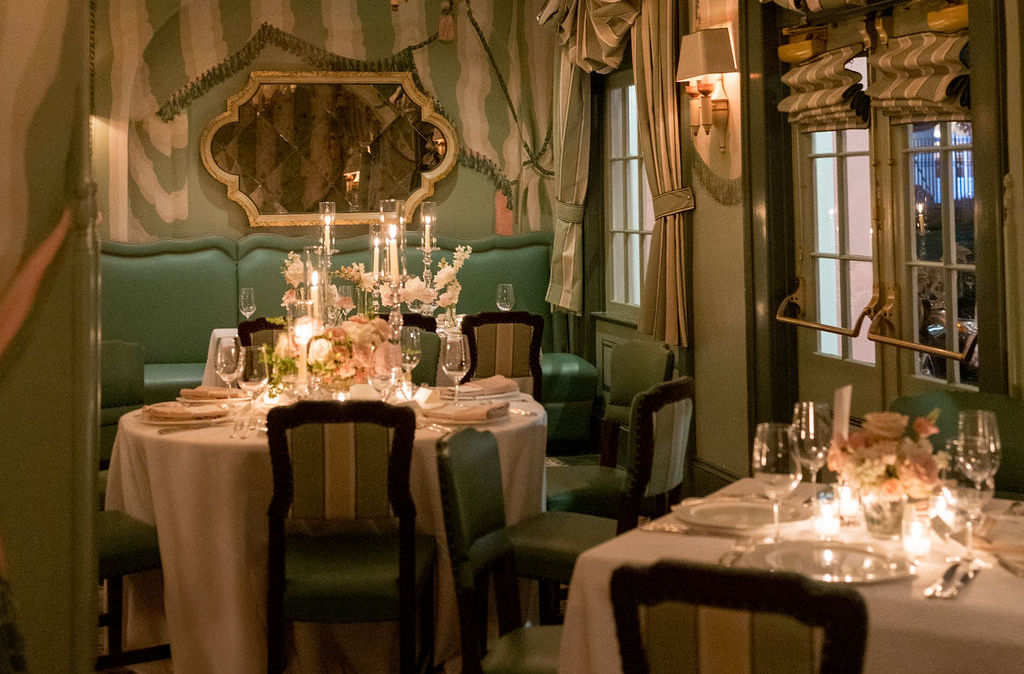 Romantic candlelit dinner party florals designed by Leaf + Petal in New Orleans for a wedding at Brennan's