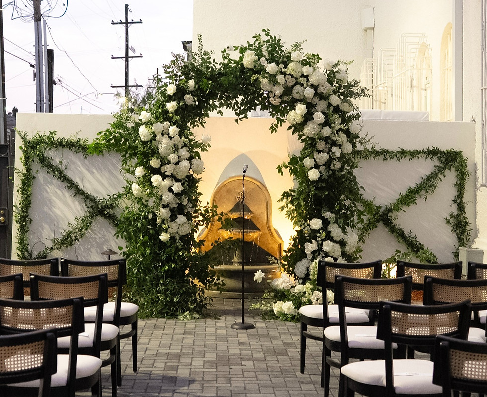 The Josephine New Orleans wedding ceremony arch with white floral installation by Leaf + Petal