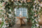 flower chuppah installtion over a cake table at Il Mercato in New Orleans, Leaf + Petal NOLA