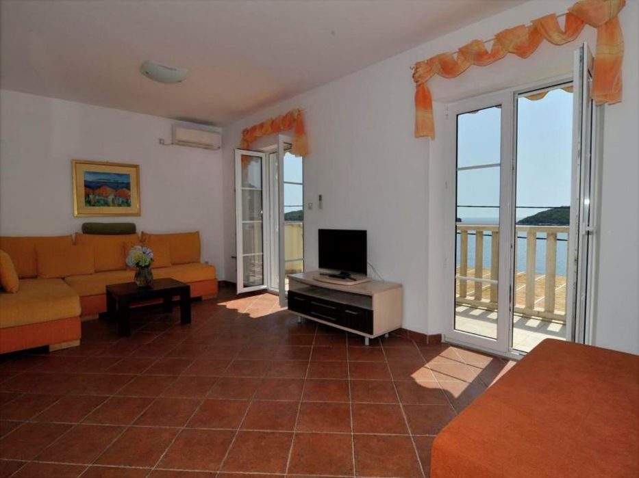 Spacious living area with seating in a Mediterranean seaside apartment