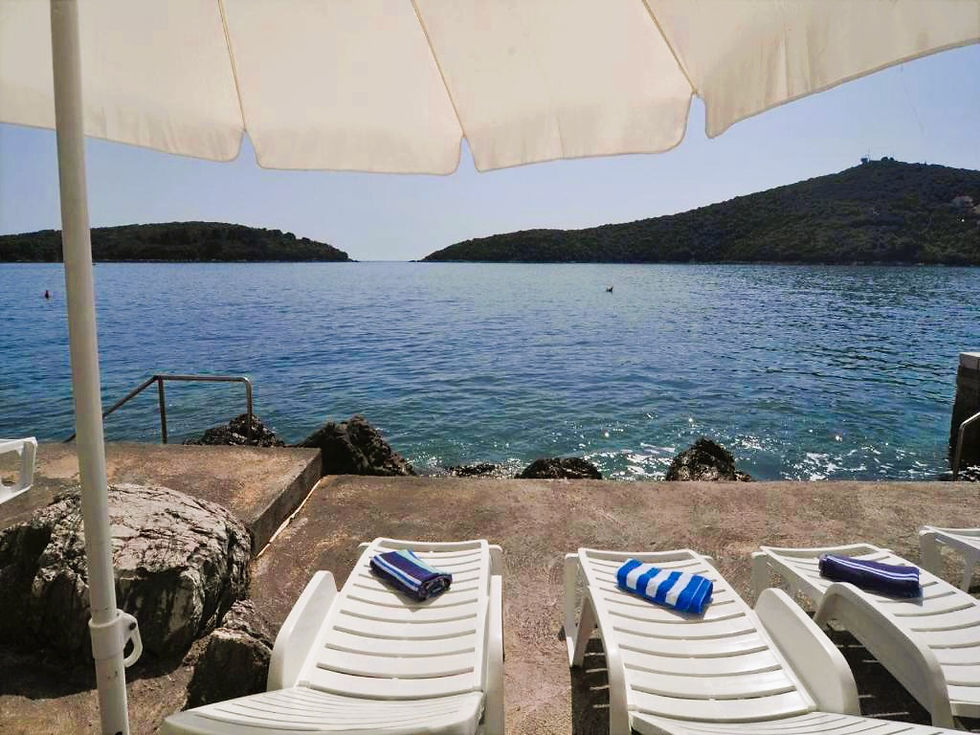 Sun loungers by the sea at Villa Marina with direct access to the Adriatic