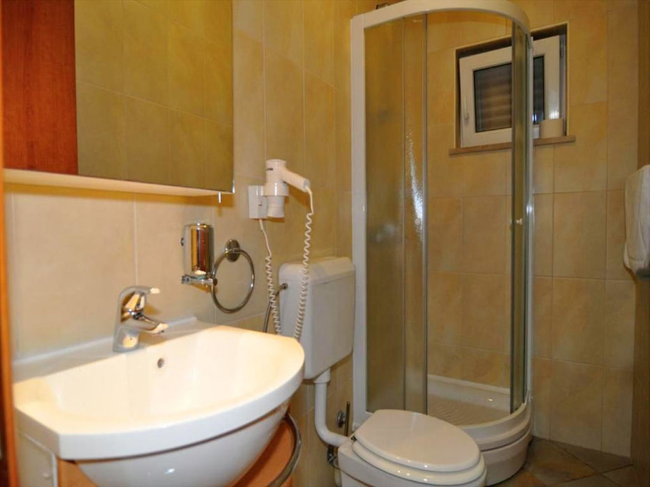 Second bathroom with a shower in a spacious sea-view apartment