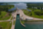 Aerial view of a cargo ship passing through a canal lock in Northern New York