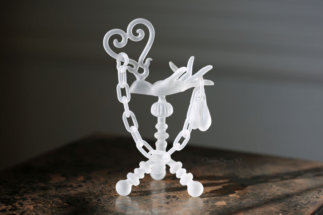 Frosted glass sculpture with chains and hearts