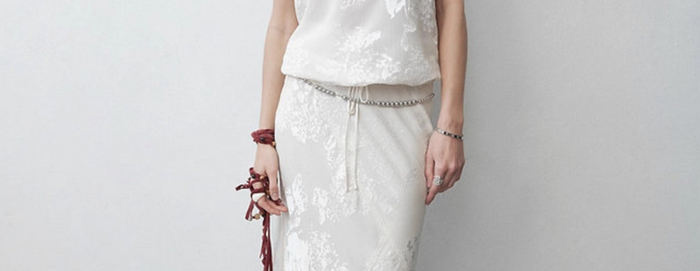 Long white skirt styled with matching white halter top burnout fabric front view