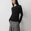 Thumbnail: black Side view of modern layered top in Tencel-wool, showing breathable fabric and natural layering