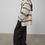 Thumbnail: white and blue striped merino hood coat side view styled with black trousers