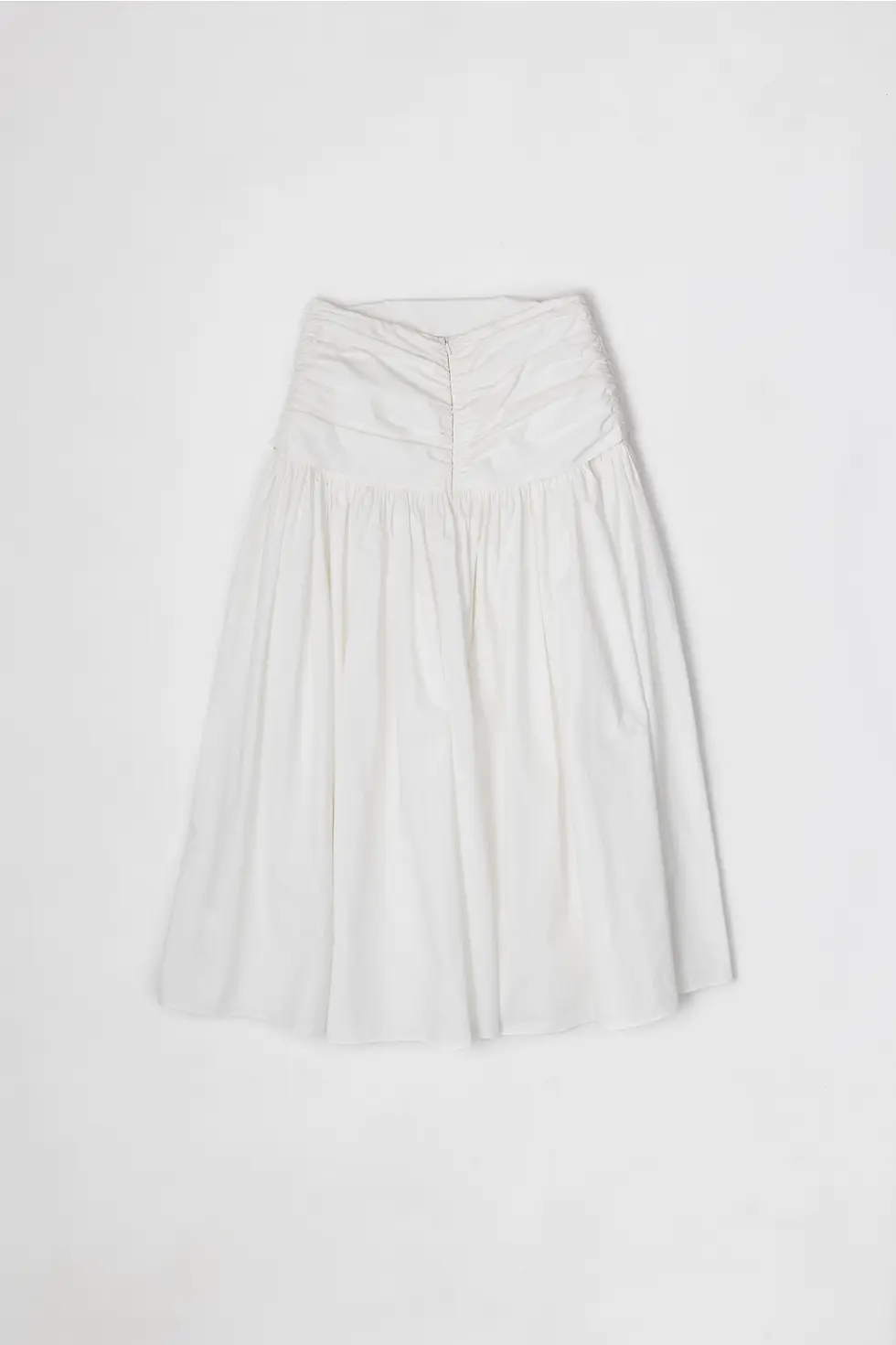 Thumbnail: Back view of flat lay of white midi skirt with ruched waist detail and full, flowing shape.